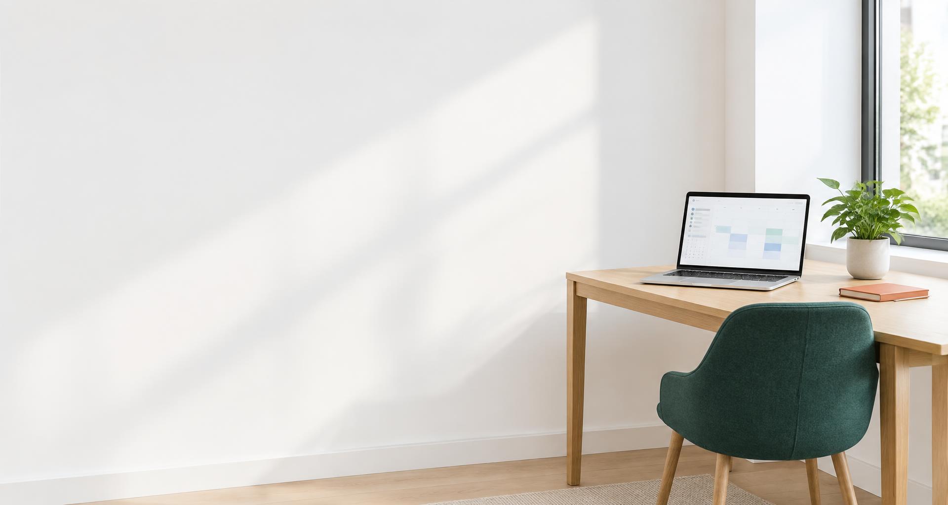 A calm consulting workspace with an appointment calendar on the laptop
